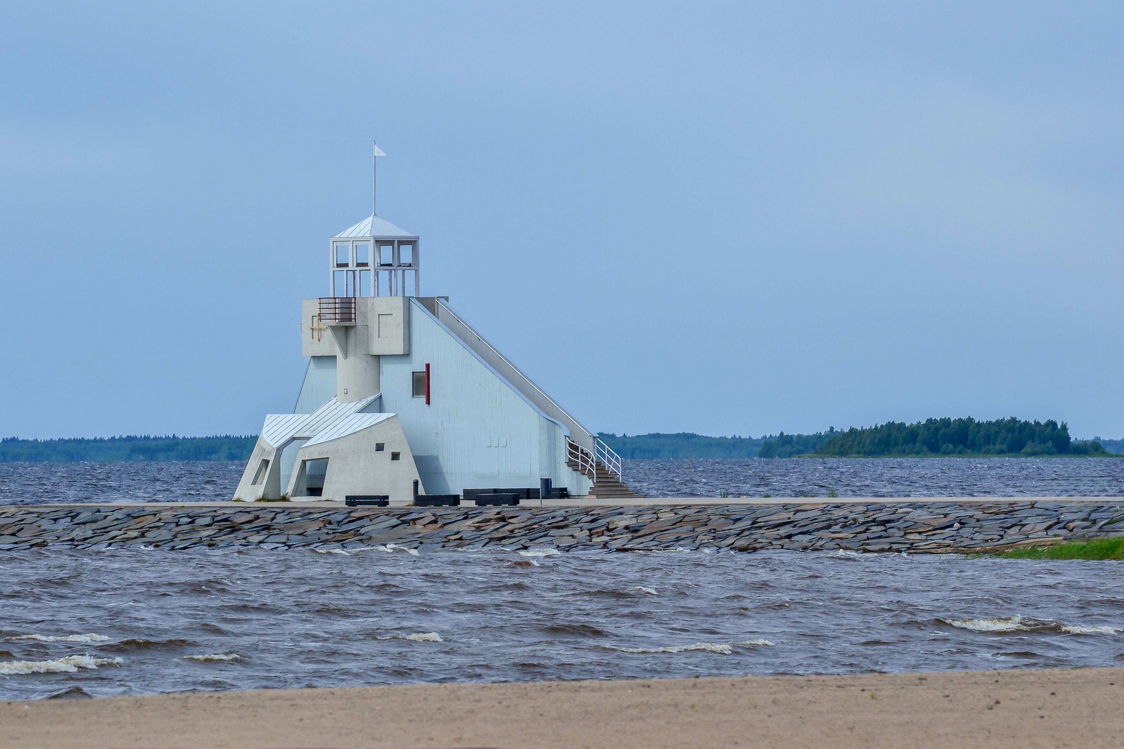 Lighthouse on the sandy beach of Nalikari in Oulu, Finland. The local landmark is also used as an observation tower for tourists. Early spring, cold, deserted.