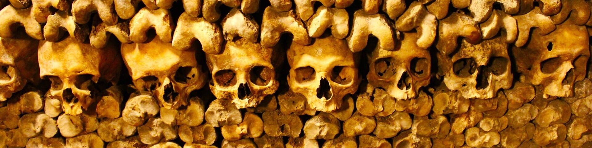 I didn’t really know what to expect from this. I assumed that it might be kind of Kitschy, as its a really popular tourist destination, (THREE hours in line) but it was anything but. You descend down a spiral staircase deep below the surface of Paris. Once down there you you are in a series of tunnels. This went on for several hundred meters, then all of a sudden, you are surrounded by the dead. This was no touristy gimmick, just the remains of millions of Parisians dating back hundred of years.
I felt almost like Indiana Jones. Before you enter the Ossuary you are met with an ancient stone marker that says: “ARRETE! C’EST ICI L’EMPIRE DE LA MORT”. (STOP! THIS IS THE EMPIRE OF THE DEAD)
This was one of the creepiest, most fascinating things I have ever done. Thanks to Michael Spyres for going with me...
The Catacombs of Paris are underground ossuaries in Paris, France, which hold the remains of more than six million people in a small part of a tunnel network built to consolidate Paris' ancient stone mines. Extending south from the Barrière d’Enfer ("Gate of Hell") former city gate, this ossuary was created as part of the effort to eliminate the city's overflowing cemeteries. Preparation work began not long after a 1774 series of gruesome Saint Innocents-cemetery-quarter basement wall collapses added a sense of urgency to the cemetery-eliminating measure, and from 1786, nightly processions of covered wagons transferred remains from most of Paris' cemeteries to a mine shaft opened near the Rue de la Tombe-Issoire.
The ossuary remained largely forgotten until it became a novelty-place for concerts and other private events in the early 19th century; after further renovations and the construction of accesses around Place Denfert-Rochereau, it was open to public visitation from 1874. Since January 1, 2013, the Catacombs number among the 14 City of Paris Museums managed by Paris Musées. Although the ossuary comprises only a small section of the underground "carrières de Paris" ("quarries of Paris"), Parisians presently often refer to the entire tunnel network as "the catacombs".
Fun Trivia: In 2004, police discovered a fully equipped movie theater in one of the caverns. It was equipped with a giant cinema screen, seats for the audience, projection equipment, film reels of recent thrillers and film noir classics, a fully stocked bar, and a complete restaurant with tables and chairs. The source of its electrical power and the identity of those responsible remain unknown...
#LIFEATEXPEDIA. #PARISCATACOMBS #TRAVEL #HILLBILLYINPARIS #IHEARTPARIS