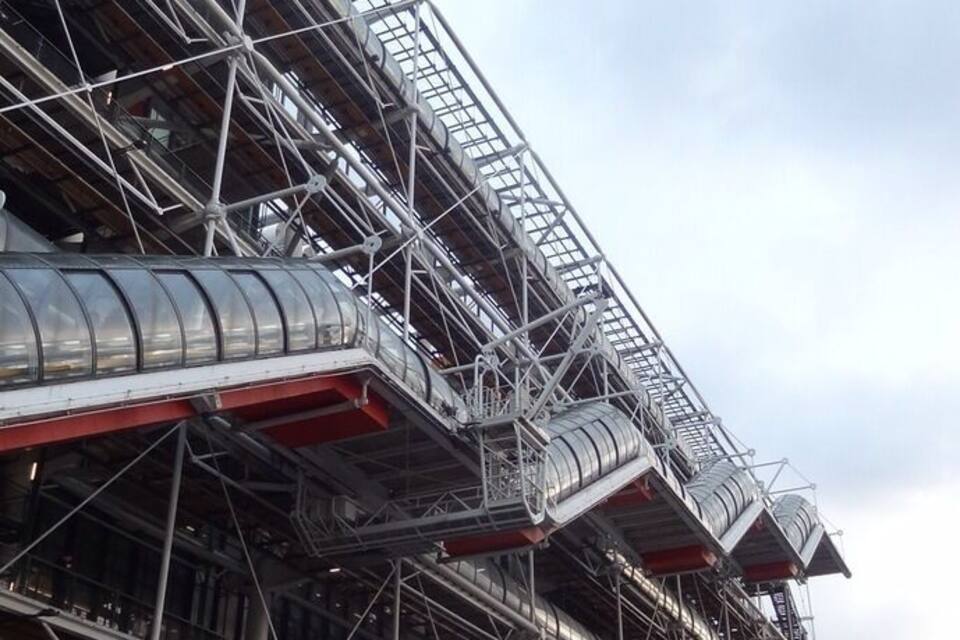 A large building with extensive scaffolding and metal structures.