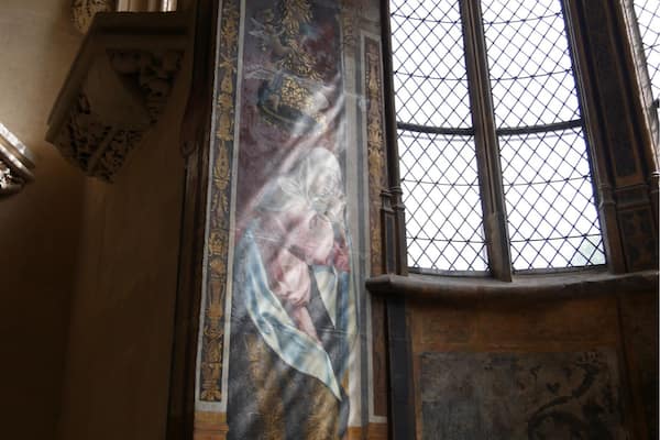 The sides of the apse in the Abbot's Chapel (Cluny Museum, Paris) are decorated with two mural paintings dating from the mid-sixteenth century (estimate) and produced in Italy. They depict the Virgin Mary's two half-sisters or sisters-in-law (depending on source), Mary Cleophas and Mary Salome, grieving over the death of Christ. Unfortunately, none of my museum books or other sources identifies which is which. I photographed the left Mary due to the sun's rays. If you know which Mary this is, please comment.