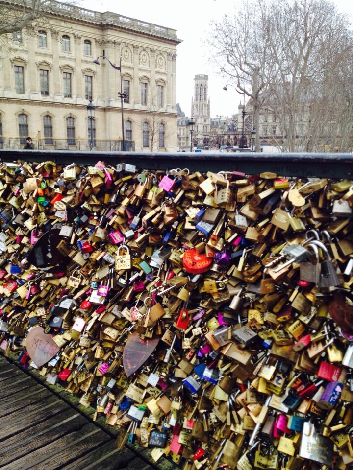 Pont des Artes Pedestrian bridge near the Louvre. Also known as Love Lock Bridge. People write their names on the locks, place it on the bridge and toss the keys into the Seine to show Devotional Love. 
