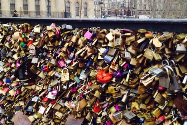 Pont des Artes Pedestrian bridge near the Louvre. Also known as Love Lock Bridge. People write their names on the locks, place it on the bridge and toss the keys into the Seine to show Devotional Love.