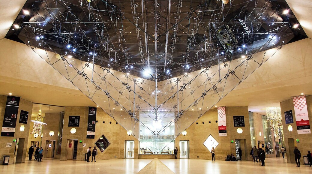 The inverted glass pyramid, of Da Vinci Code fame. I.M. Pei added this pyramid to act as a giant skylight (although this photo was taken at night). It's a popular spot to pose for photos, so you'll need to go during off-peak hours and be patient to get a clear photo.
