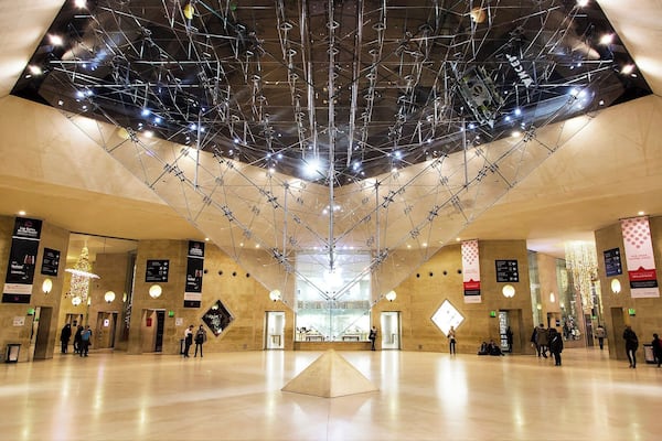 The inverted glass pyramid, of Da Vinci Code fame. I.M. Pei added this pyramid to act as a giant skylight (although this photo was taken at night). It's a popular spot to pose for photos, so you'll need to go during off-peak hours and be patient to get a clear photo.
