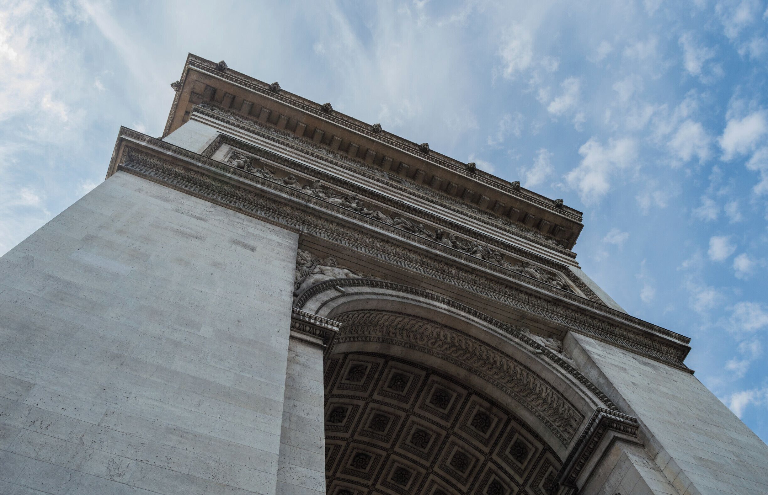 he Arc de Triomphe de l'Étoile is one of the most famous monuments in Paris. It stands in the center of the Place Charles de Gaulle, at the western end of the Champs-Élysées. It was established in 1836.