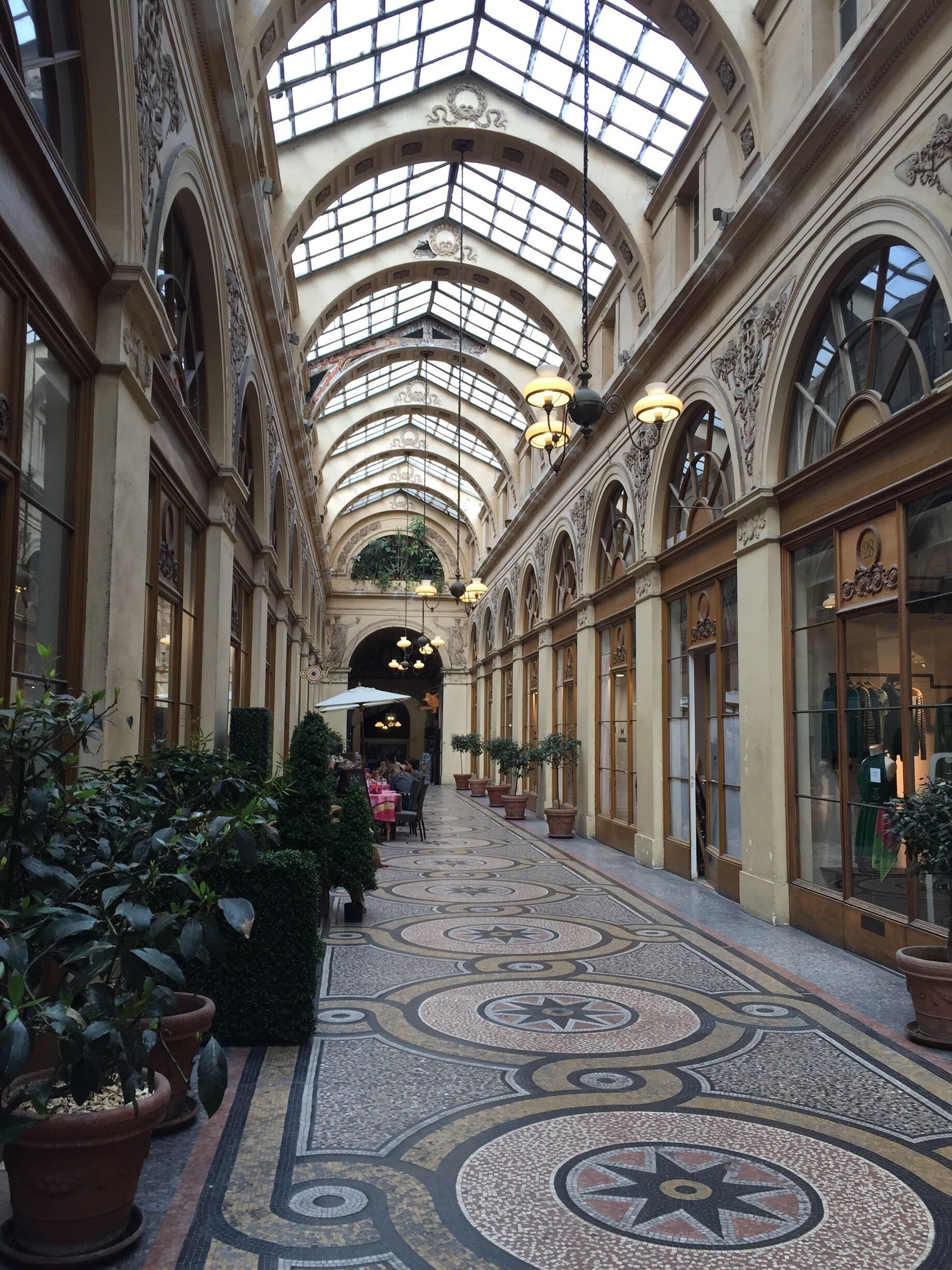 One of the oldest covered arcades in Paris, Gallerie Vivienne houses some shops, cafes, and an old bookstore.