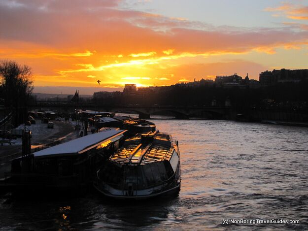 Visiting Europe in the winter means it gets dark at 4pm. 

We'd just come down from the Eiffel Tower and were crossing back to the main shopping area.

I don't do a lot of post-processing - this photo is pretty much as taken - I shot into the sun, couldn't see much at the time! 

I never knew the name of the bridge until just now! 