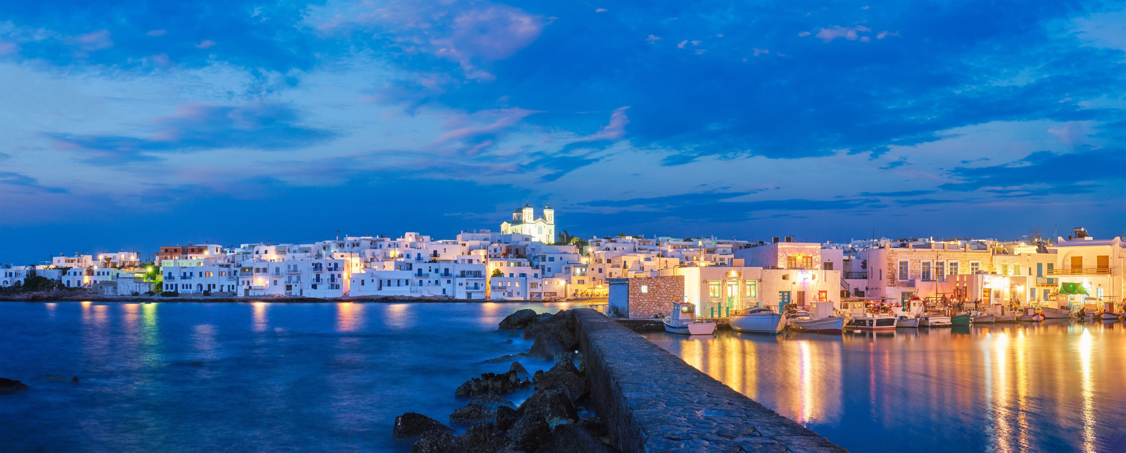 Panorama of picturesque Naousa town on Paros island, Greece in the night