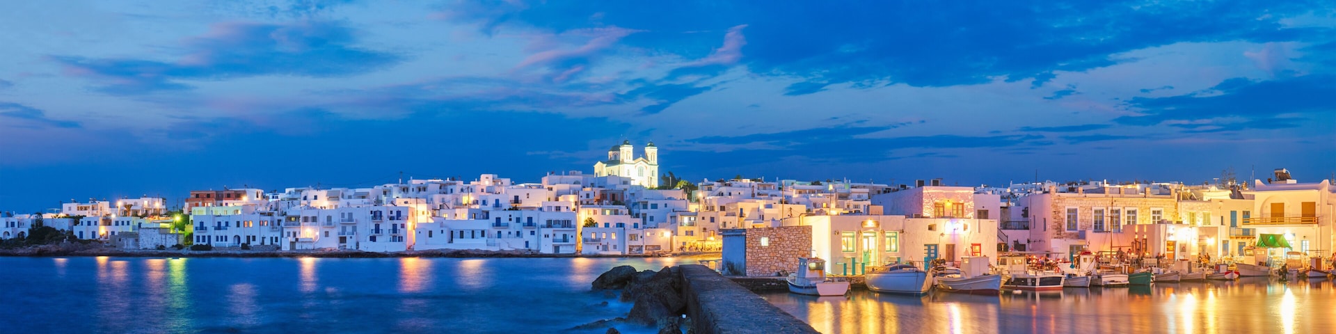 Panorama of picturesque Naousa town on Paros island, Greece in the night