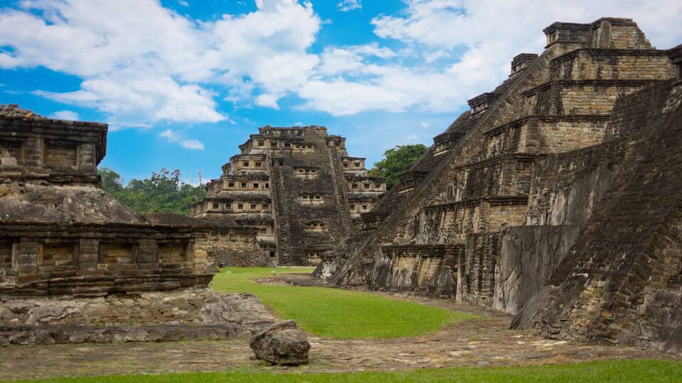 Ancient stone structures with a clear sky.