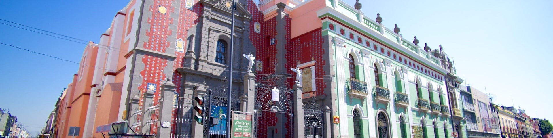 A colorful historic building with intricate architecture and a prominent tower.