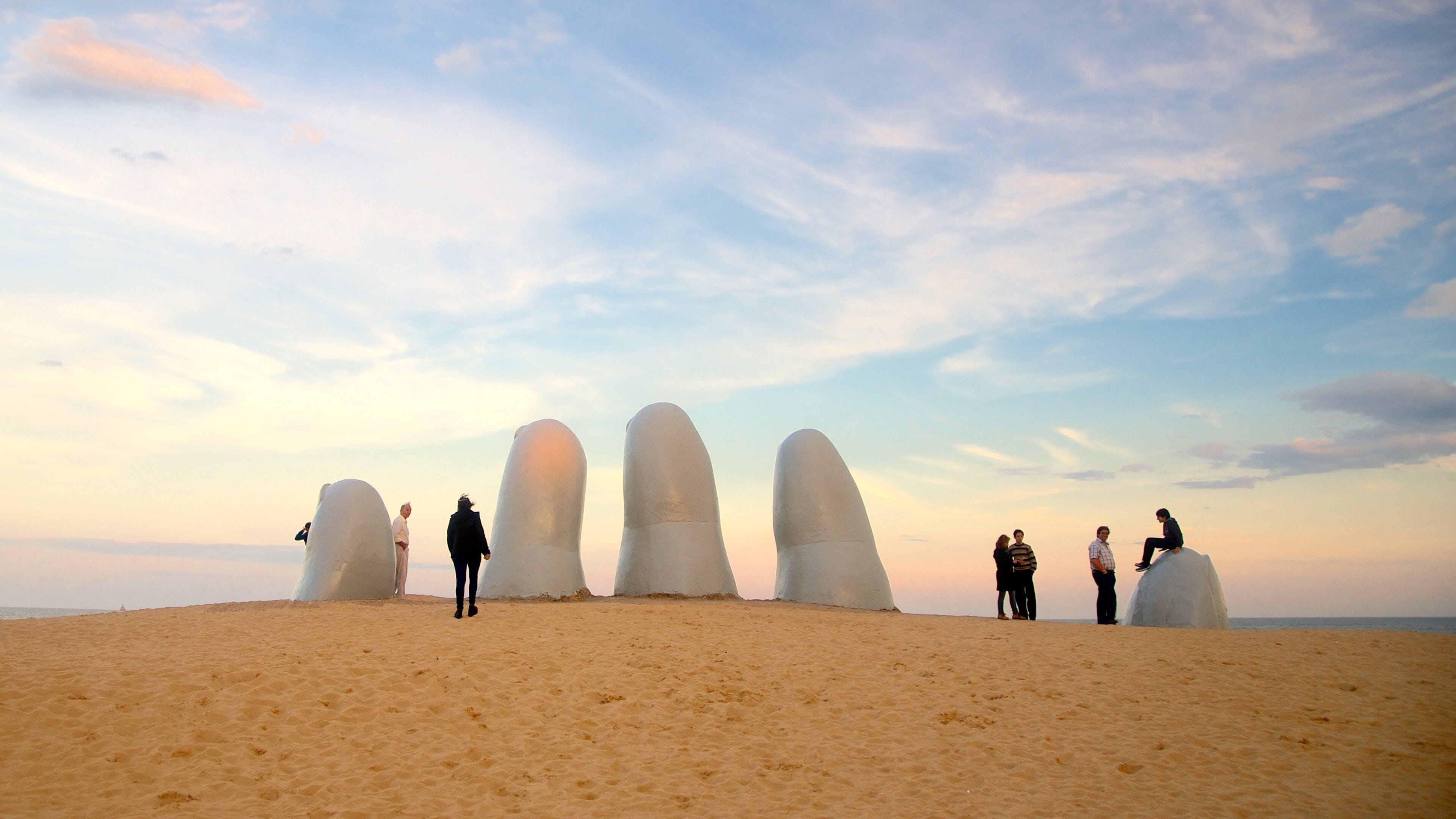 Punta del Este which includes a statue or sculpture, a sunset and general coastal views