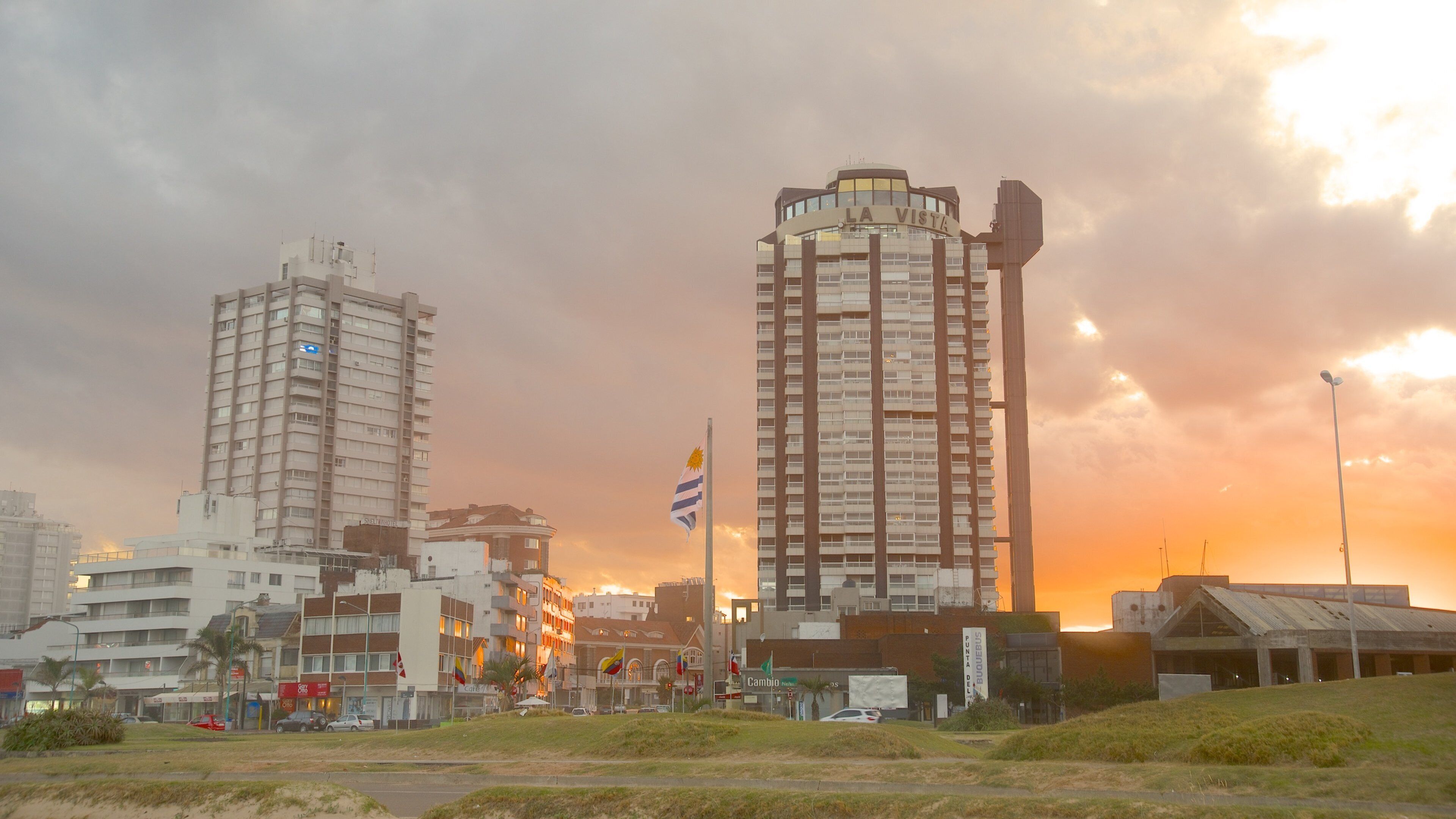 Punta del Este featuring a sunset and a city