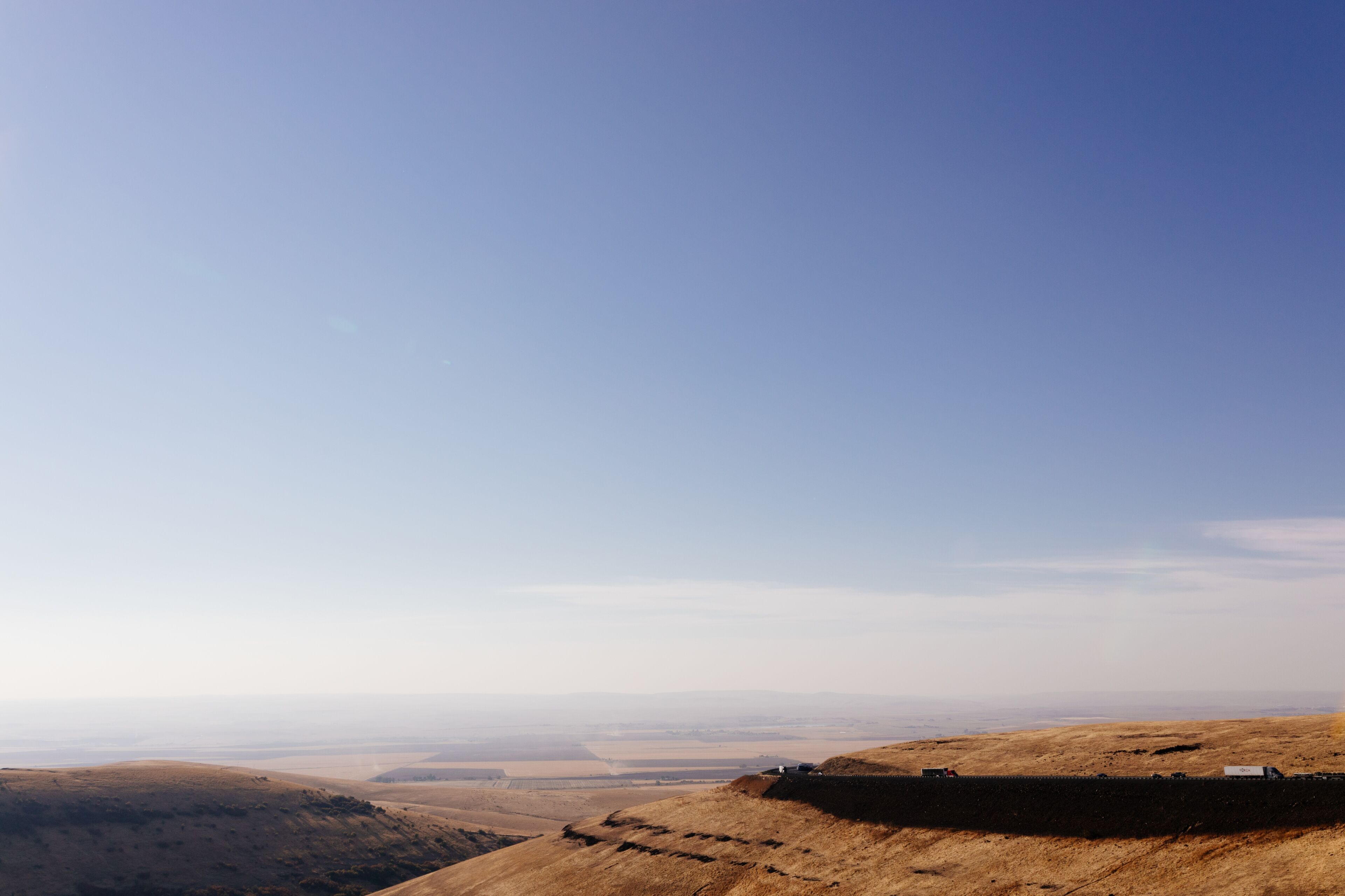Beautiful autumn landscape with meadows and a road from a bird's eye view. Nature in Oregon in fall. Panorama. Pendleton, Oregon, USA