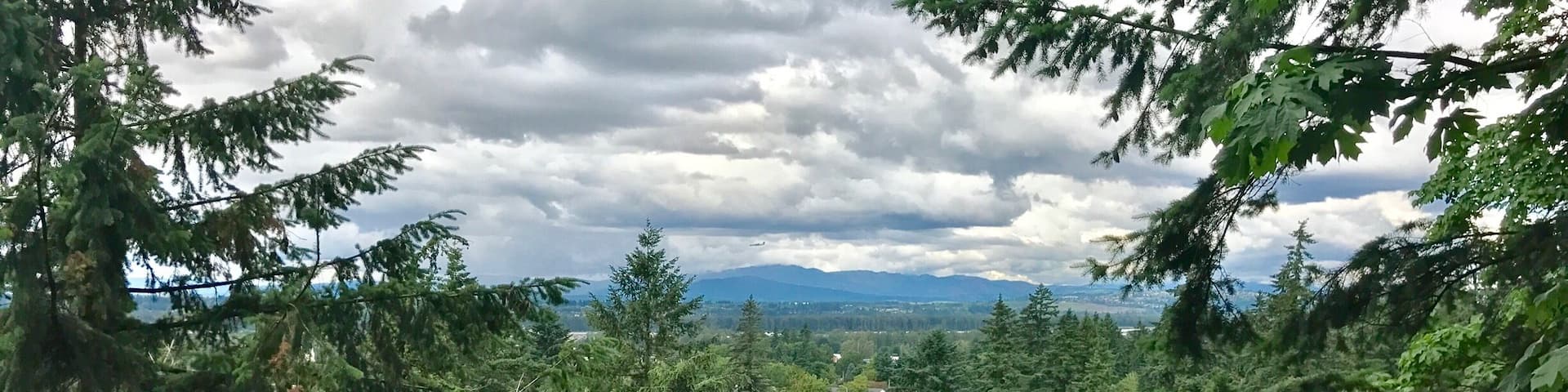 Cloudy but beautiful view of Mt. St. Helens from 2nd level gardens at The Grotto.