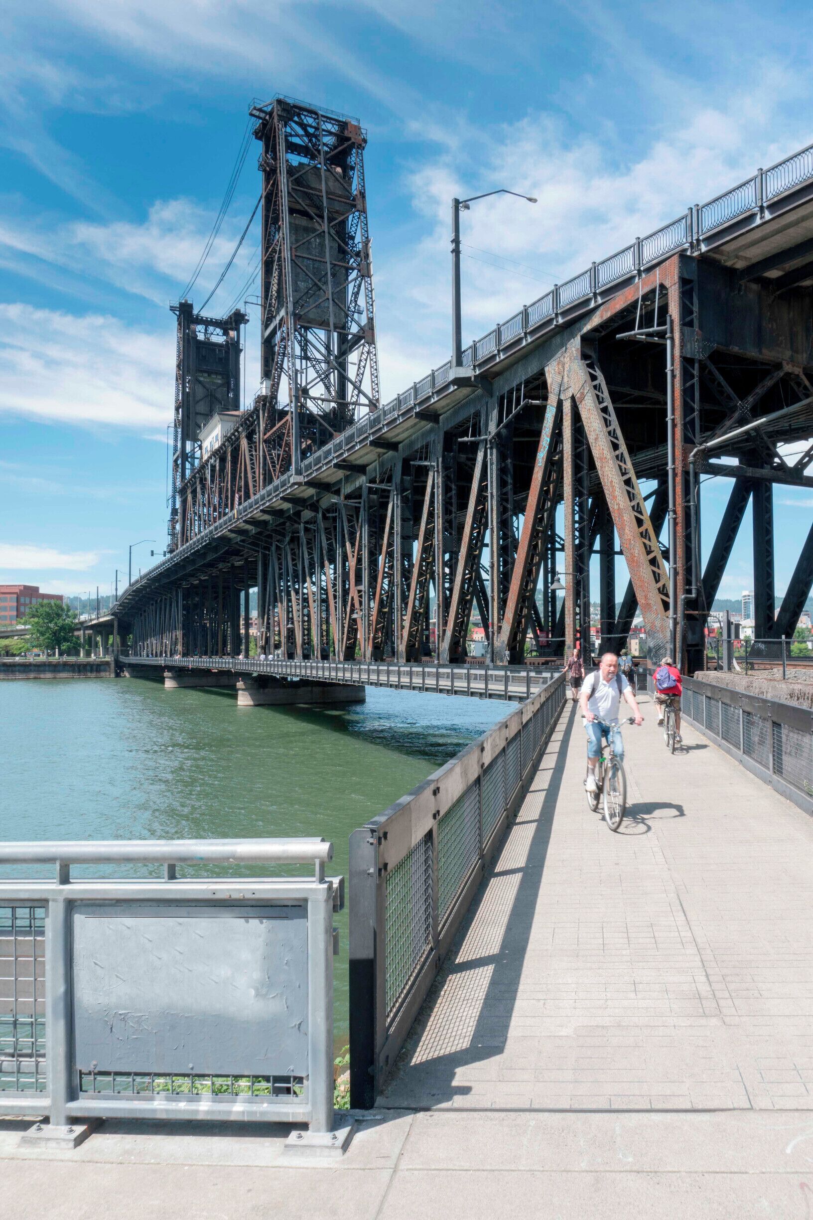 Cross back across the Willamette River along the pedestrian walk below the Steel Bridge to the East side Esplanade.
