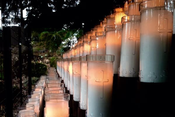 Votive candles flank each side of the grotto in Portland.