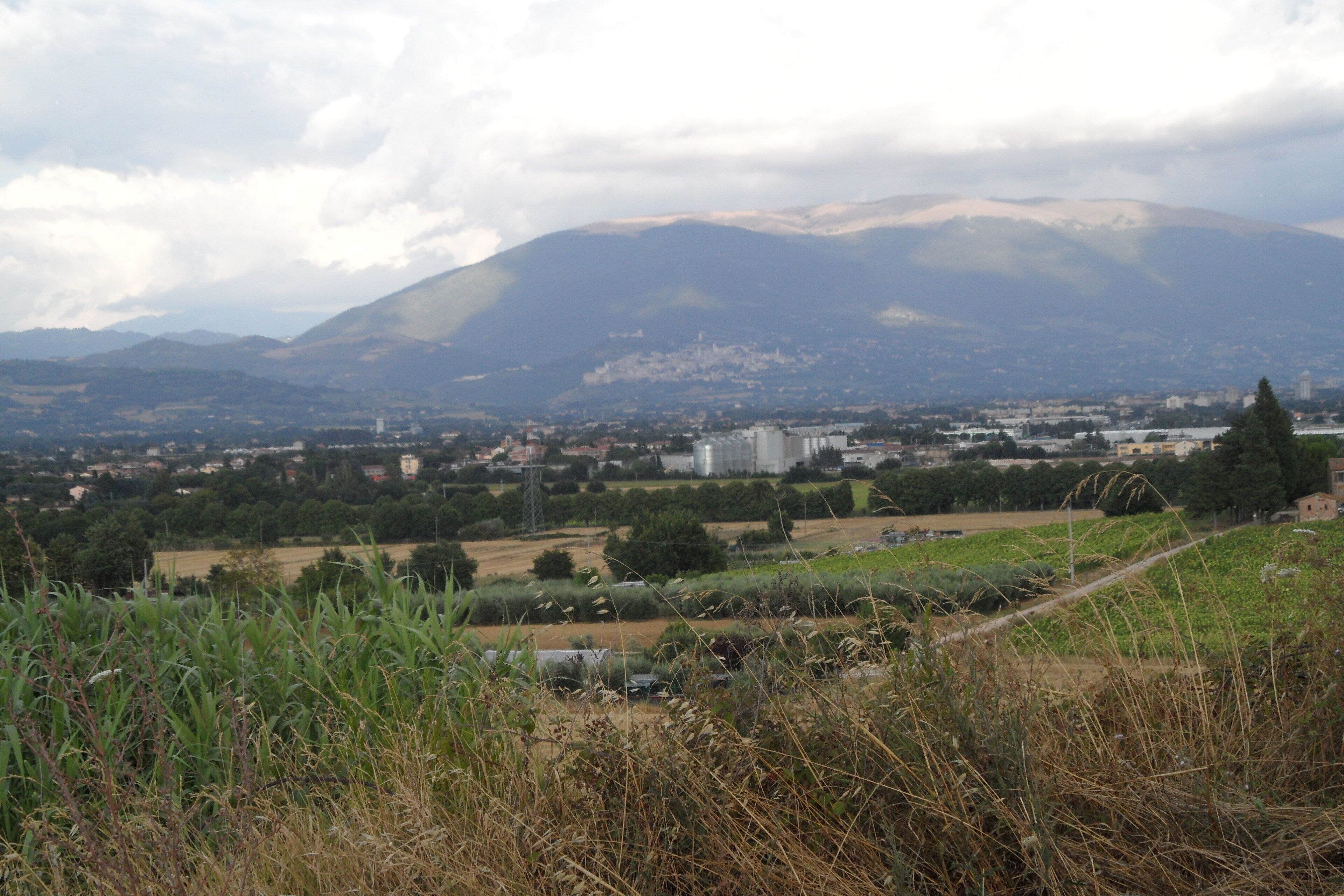 A mountainous landscape with a town in the valley.