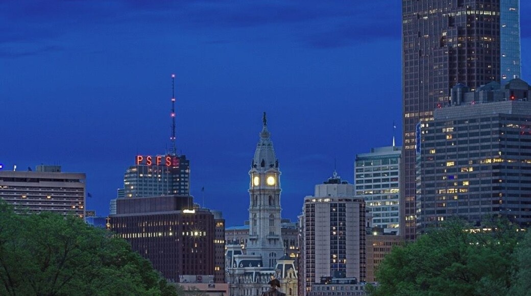 Looking over Benjamin Franklin Parkway in Philadelphia. I took this image from the steps of the Philadelphia Museum of Art during the golden hour. The museum is where Rocky Balboa ran up the stairs to a triumphant culmination of his training. Raising his hands up in victory as a metaphor for an underdog rising to the challenge.