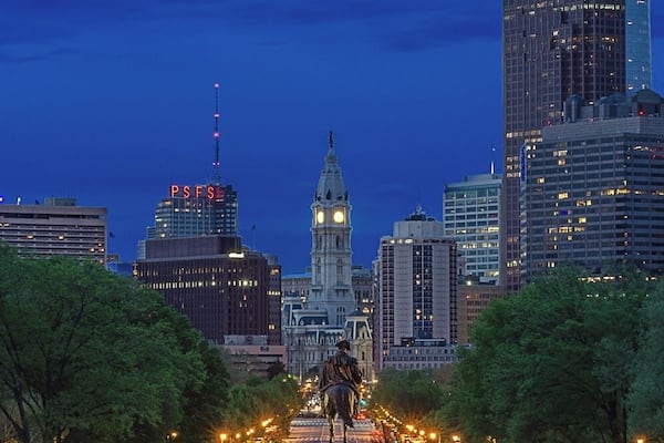 Looking over Benjamin Franklin Parkway in Philadelphia. I took this image from the steps of the Philadelphia Museum of Art during the golden hour. The museum is where Rocky Balboa ran up the stairs to a triumphant culmination of his training. Raising his hands up in victory as a metaphor for an underdog rising to the challenge.