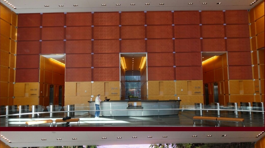 The main lobby of the Comcast Center holds quite the surprise for first time visitors, an art installation titled, The Comcast Experience. The back wall looks just like the other surrounding wood paneled wall when in fact it is a 2,000 square feet high-definition LED screen composed of 7.8 million pixels. The display runs eighteen hours each day. The content of the video includes panoramic views of Philadelphia historic sites, images of space, dancers, acrobats and actors moving around a background designed to mimic wood paneling of the walls of the lobby.