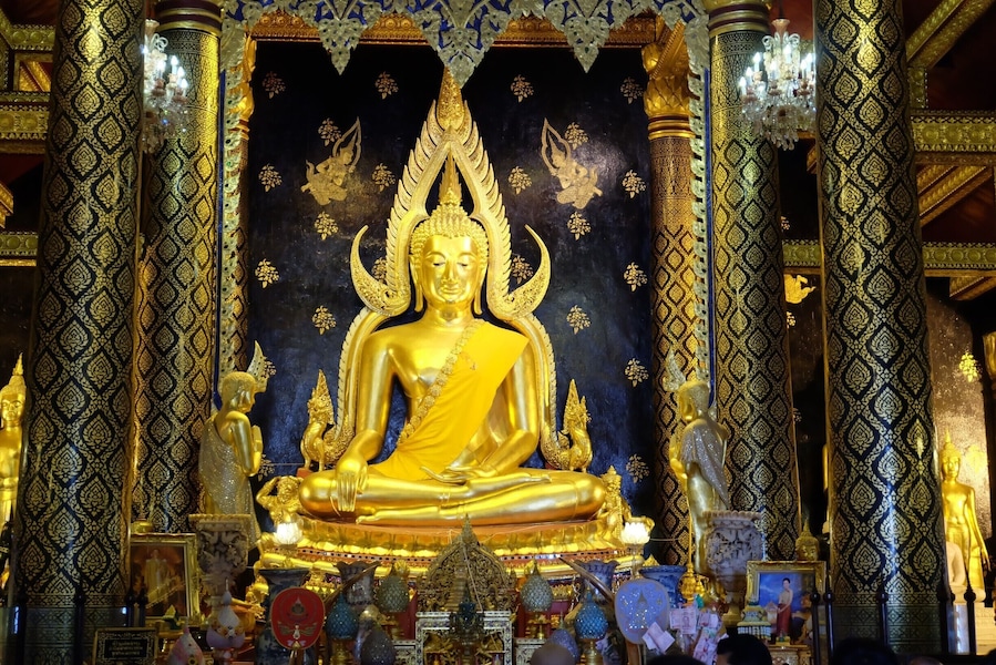 Beautiful The attitude of subduing Mara Buddha Image in Thailand . In Sukkhothai period .The Lord has a wide elbow 5 1 5 creep natak inches (2.875 m) high seven cubit (3.5 meters) with cast polished bronze Buddha.