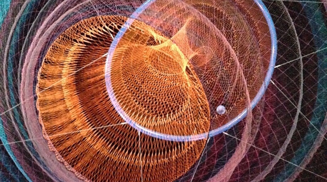 Underneath a sculpture by Janet Echelman. Saw this in the day then decided to go at night and it had a completely different personality