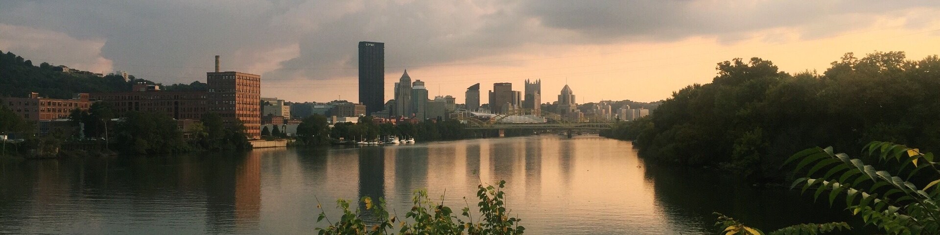 View of downtown Pittsburgh from the end of Herr's Island. Rent a bike and ride the trails alongside the river to Herr's Island and have a drink or lunch at Redfin Blues.