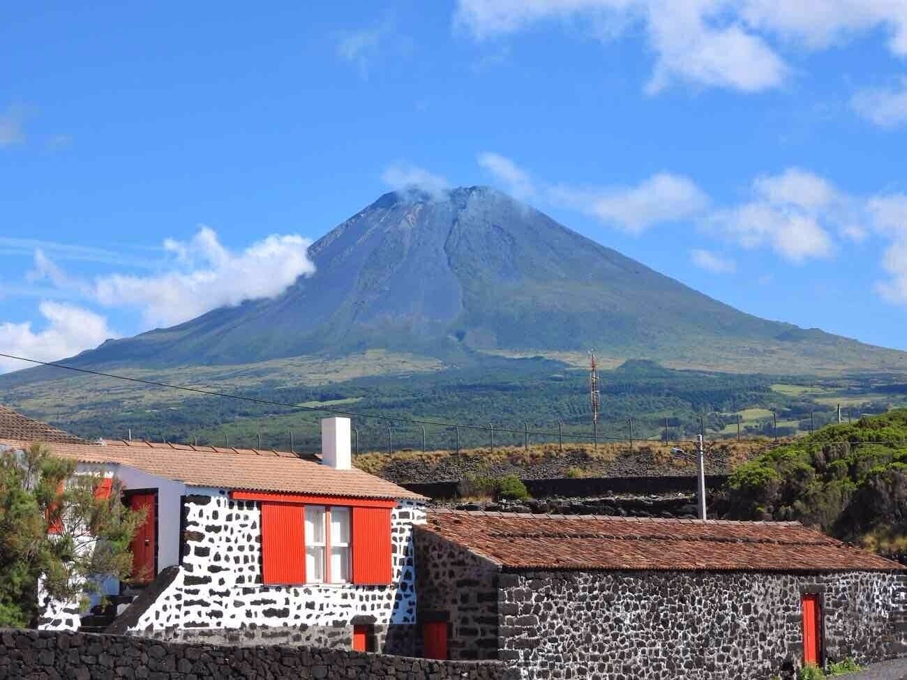 Pico, the second largest island in Azores, is nicknamed “grey island” because it’s the most volcanic and basaltic of them all. Dramatic landscapes of all kinds of lava formations dominate the scenery, contrasting with the blue of the ocean and the white from the foam of the waves.

Pico is all about 3 things: mountain, wine and whales. Read more about it:
https://www.geekyexplorer.com/pico-travel-guide/

#Azores #Pico #Portugal #Mountain #Vineyards