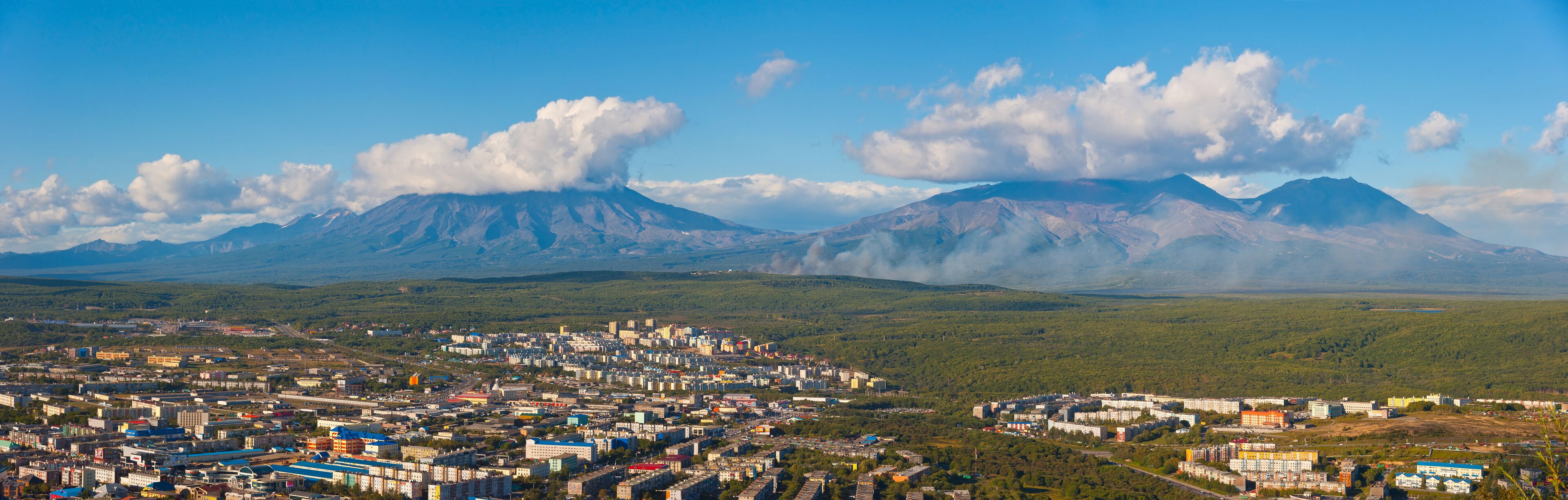 Panoramic view of Petropavlovsk-Kamchatsky and Koryaksky and Avachinsky and Kozelsky volcanoes from Mishennaya Sopka, 2012. 