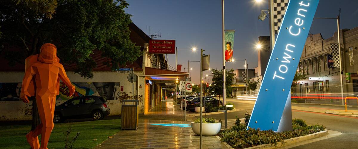 Parkes featuring night scenes, outdoor art and signage