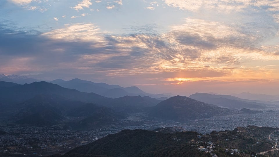 Panoramic view of snow-covered Himalaya peaks of a mountain ridge Annapurna at sunrise, under the first beams of the sun.