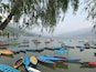 Parked Coloured boats in Phewa Lake. Do not forget to take a Boat trip if you are in Pokhara. Its a long and relaxing trip and and not so expensive.