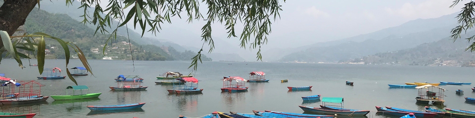 Parked Coloured boats in Phewa Lake. Do not forget to take a Boat trip if you are in Pokhara. Its a long and relaxing trip and and not so expensive.