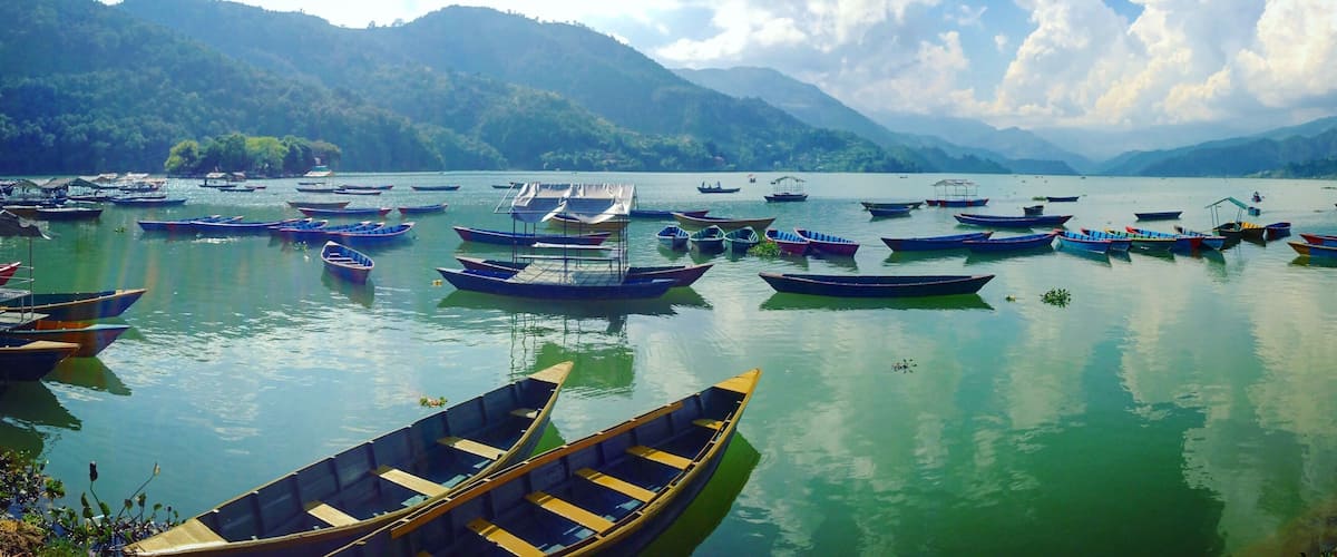 Taking time to relax lakeside in Pokhara, Nepal is necessary to escape the hustle and bustle of Katmandu, or put your feet up after hiking in the Himalayas! #lifeatexpedia #green