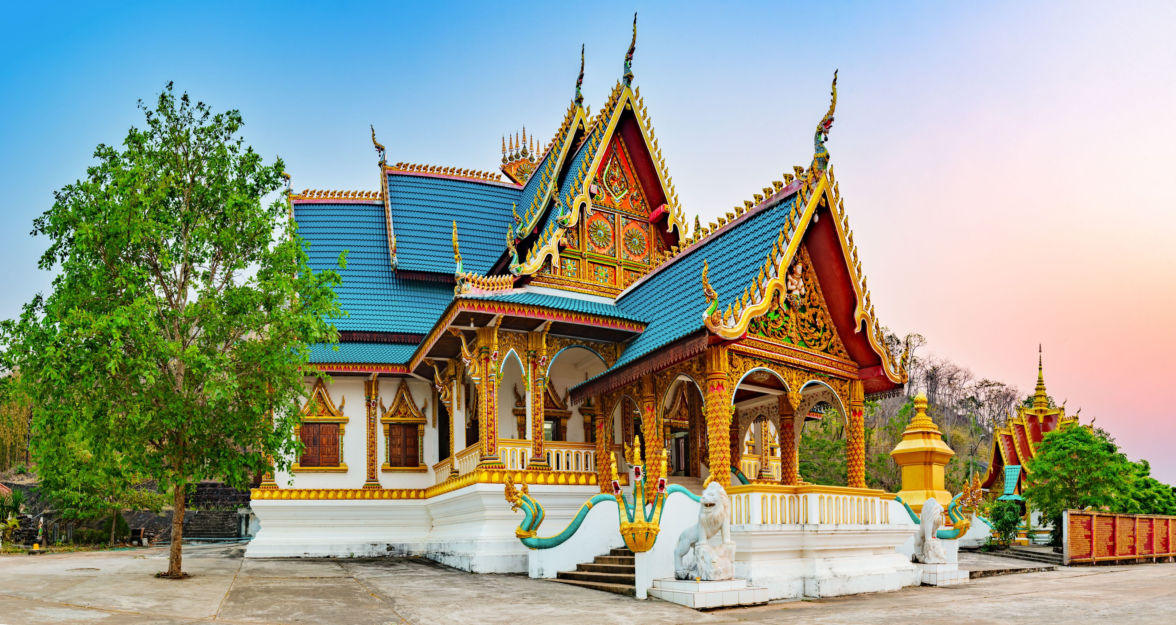 Wat Phusalao amidst greenery. Pakse, Laos. Panorama