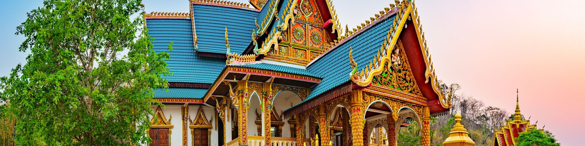 Wat Phusalao amidst greenery. Pakse, Laos. Panorama