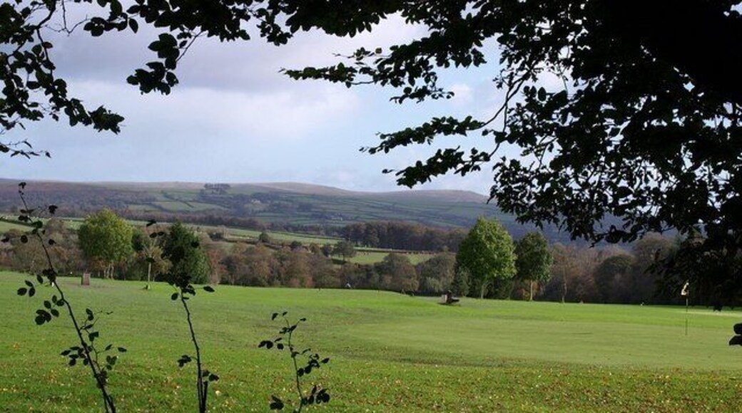 Sparkwell Golf Course A green on the 9 hole golf course, seen from the permissive path through Smuggler's Coppice. Beyond is the southwestern edge of Dartmoor.