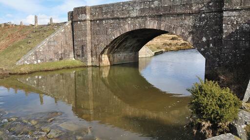 Cadover Bridge on the Southern edge of Dartmoor. The bridge is over the River Plym and is on the edge of the open moors.