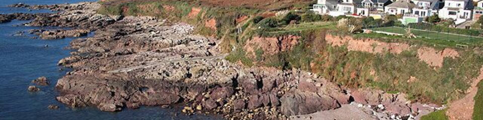 Wembury: coast at Heybrook Bay Looking towards Cawsand Bay with the neighbouring Cornish villages of Cawsand and Kingsand across the water, in the distance