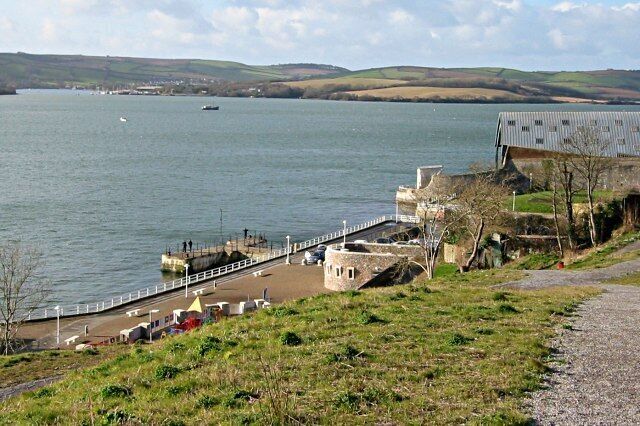 Mutton Cove This piece of shoreline used to be an important civilian waterfront access point. The building on the right is a covered slipway which marks the southernmost point of the huge naval dockyard at Devonport. The jetty is now used mainly by anglers.