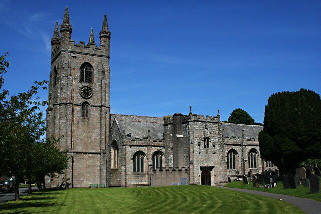 A historic church with a tall tower and arched windows.