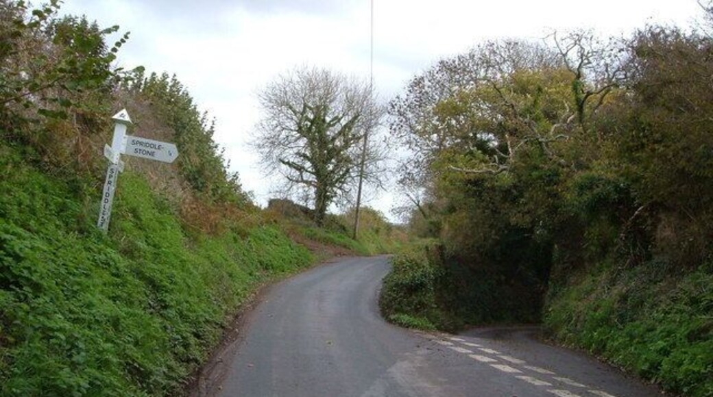 Spriddlestone Cross The small lane to the right plunges down to Spriddlestone; the main lane ahead goes to Brixton.