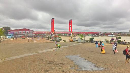 Ampera Bridge with an area of 400.6 Km2, 1,177 meters long and 22 meters wide