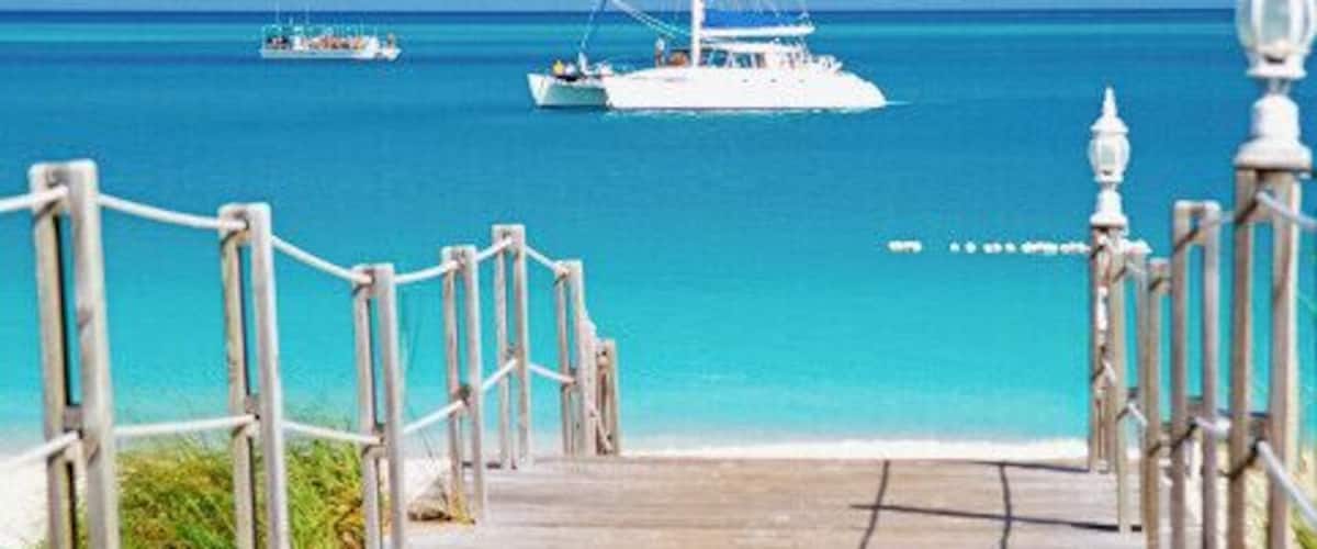 Caribbean, Turks and Caicos Islands, Providenciales, Grace Bay Beach, Boardwalk over a sea