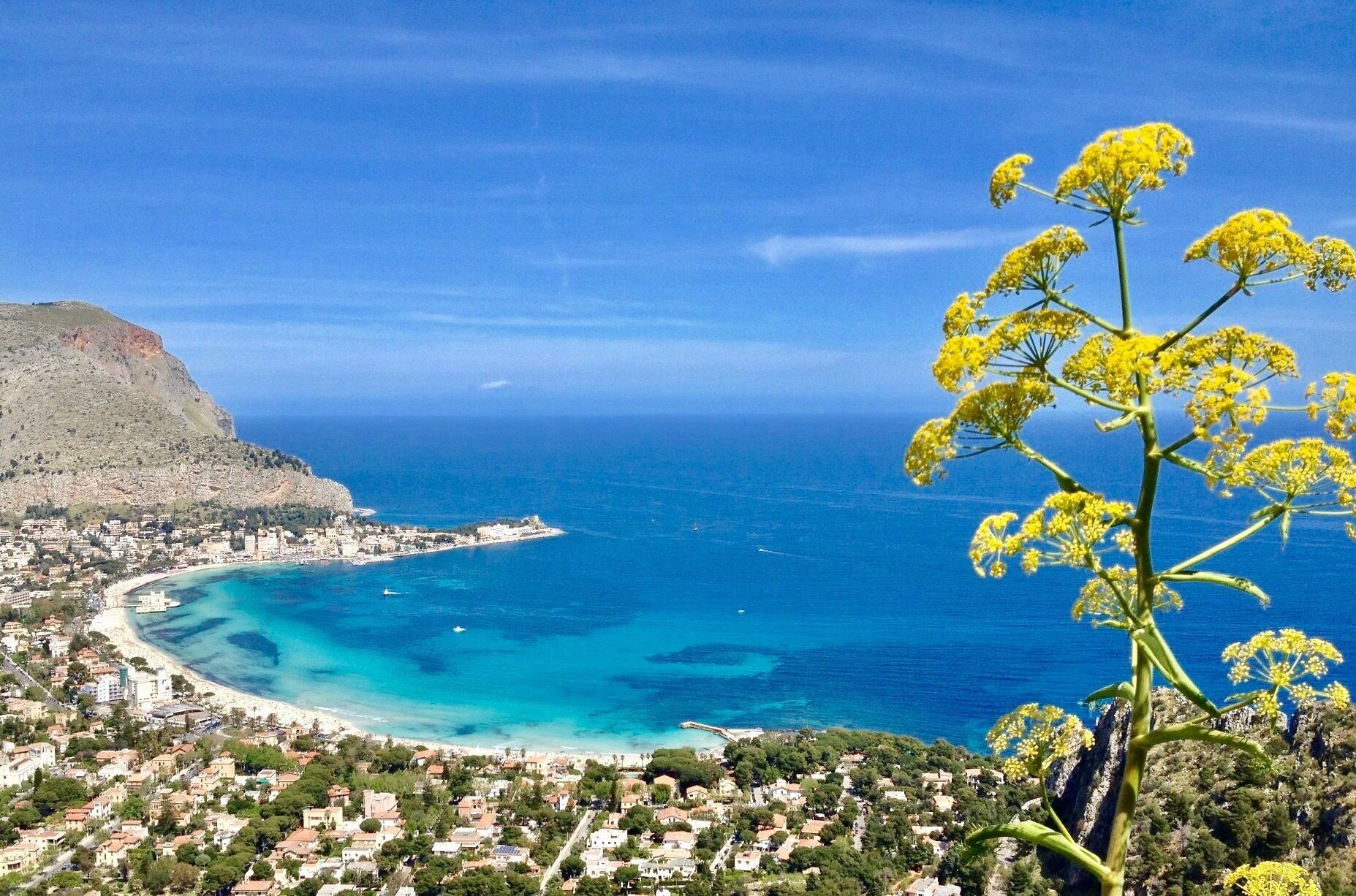 Mondello is Palermo's beach; a small resort just outside Palermo in Sicily with soft pale sand and clear turquoise water - escape the city and visit it #LifeAtExpedia