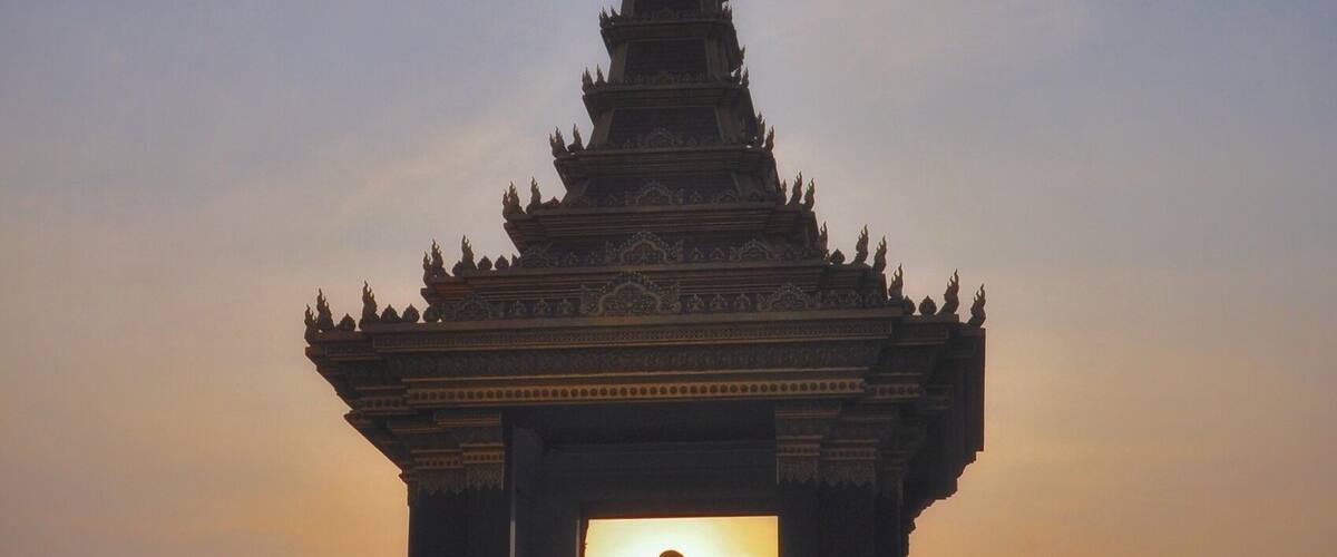 Sun setting behind the Statue of King Father Norodom Sihanouk