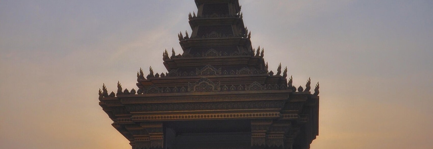 Sun setting behind the Statue of King Father Norodom Sihanouk