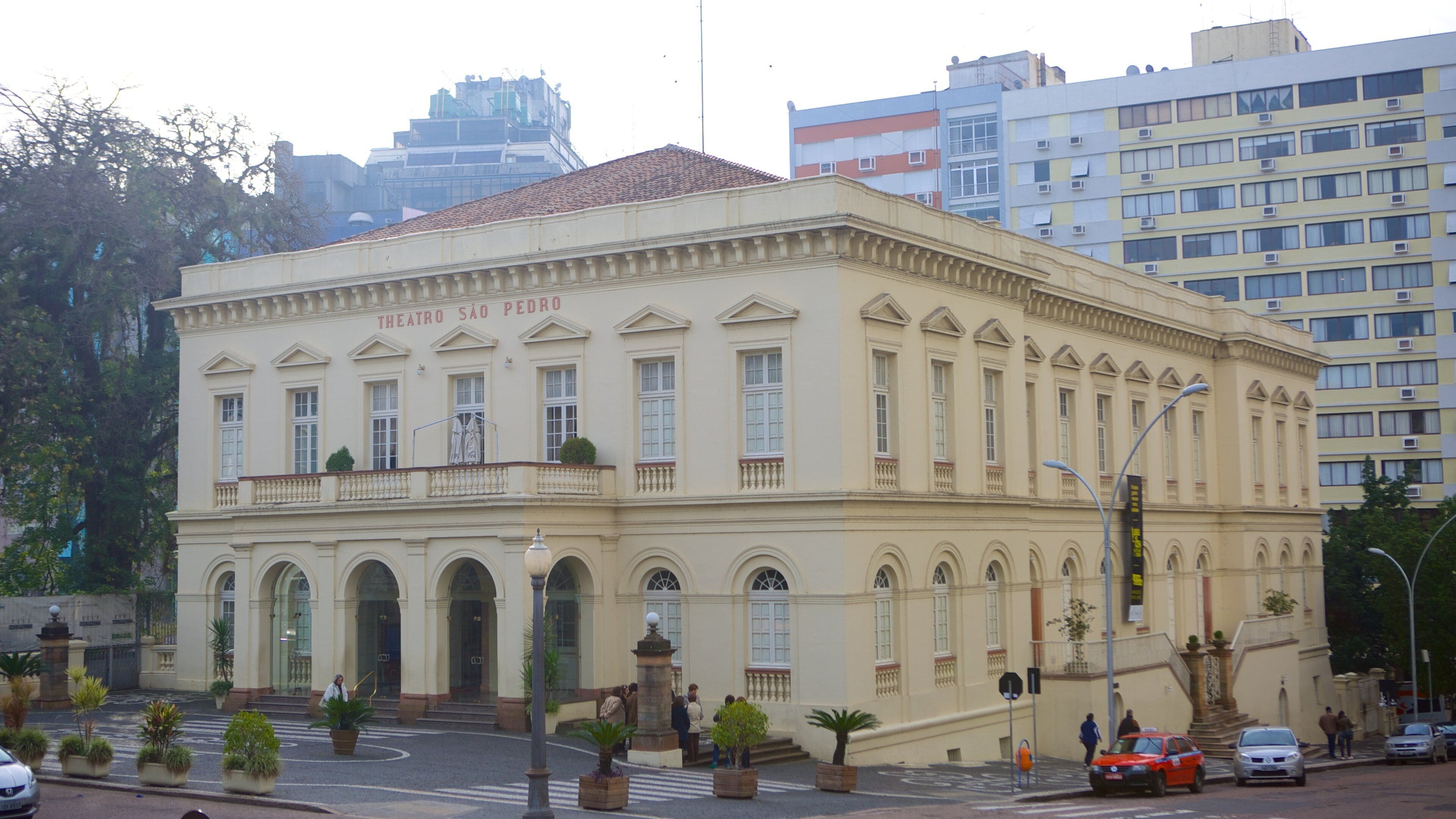A historic building with the sign "Theatro São Pedro" on its facade.