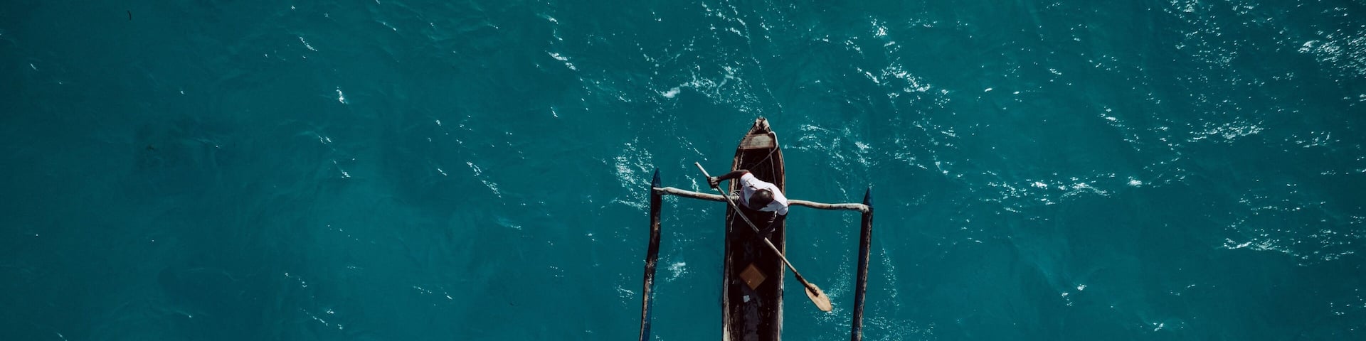 Traditional canoe paddling in Mozambique